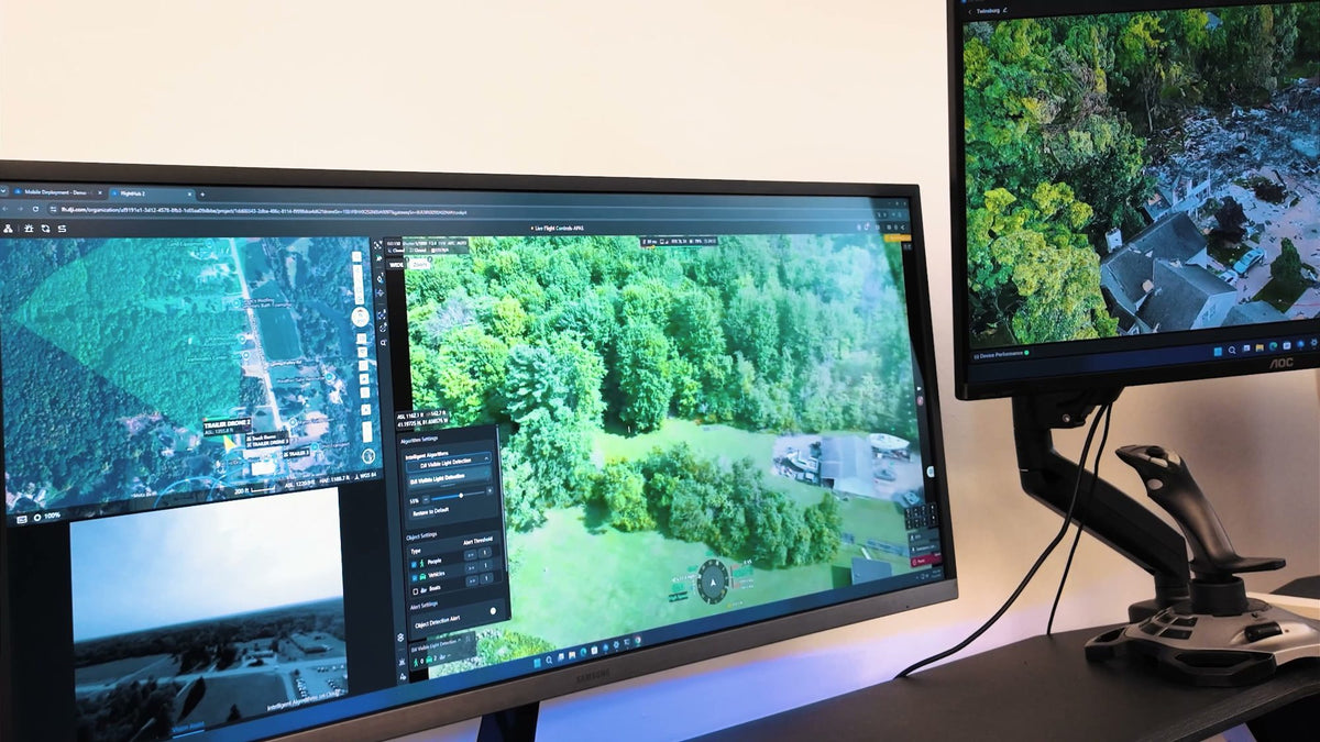 Command center with drone video on screen