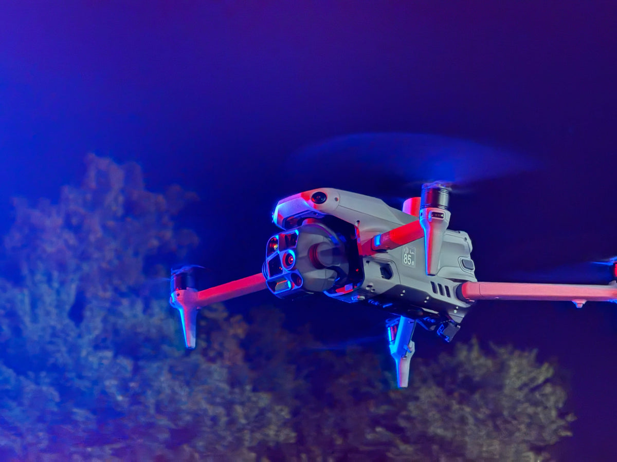 DJI Matrice 4T at night under emergency lights
